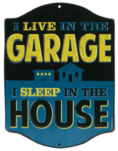 1953-2020 Universal Universal Embossed Tin Sign - I Live In The Garage But I Sleep In The House